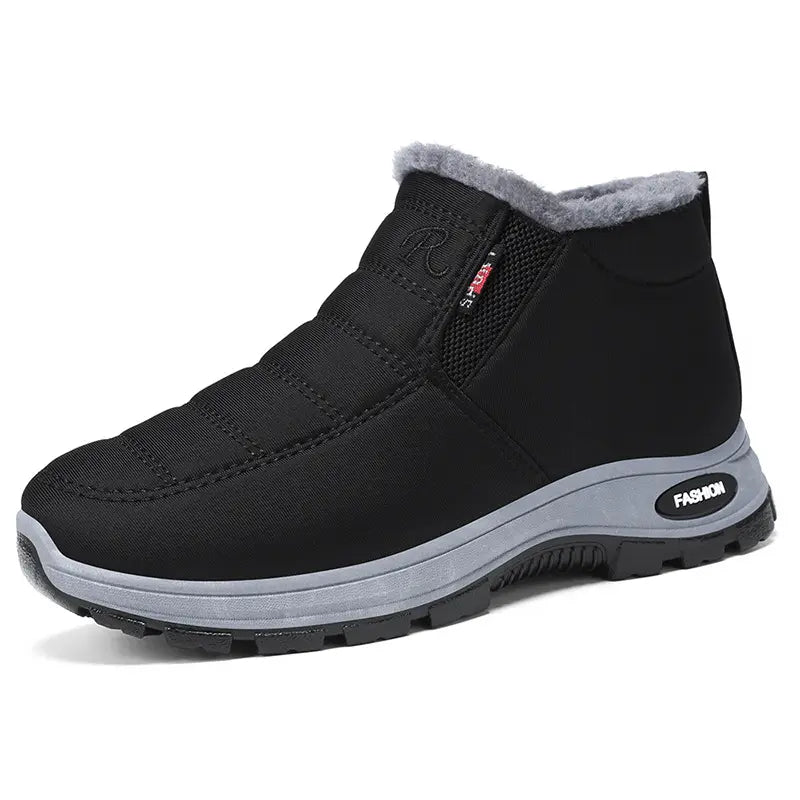 Zylpha black quilted slip-on winter boot with plush faux-fur lining, round toe, and durable rubber lug sole, showcasing the &