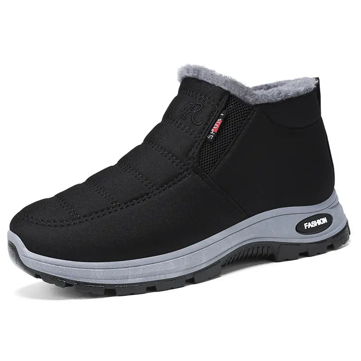 Zylpha black quilted slip-on winter boot with plush faux-fur lining, round toe, and durable rubber lug sole, showcasing the &