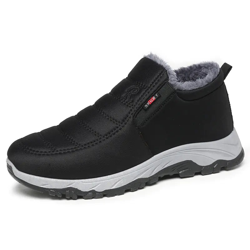 Black quilted synthetic winter boot with plush faux-fur lining, round toe, and durable rubber lug sole, shown in a three-quarter front view.