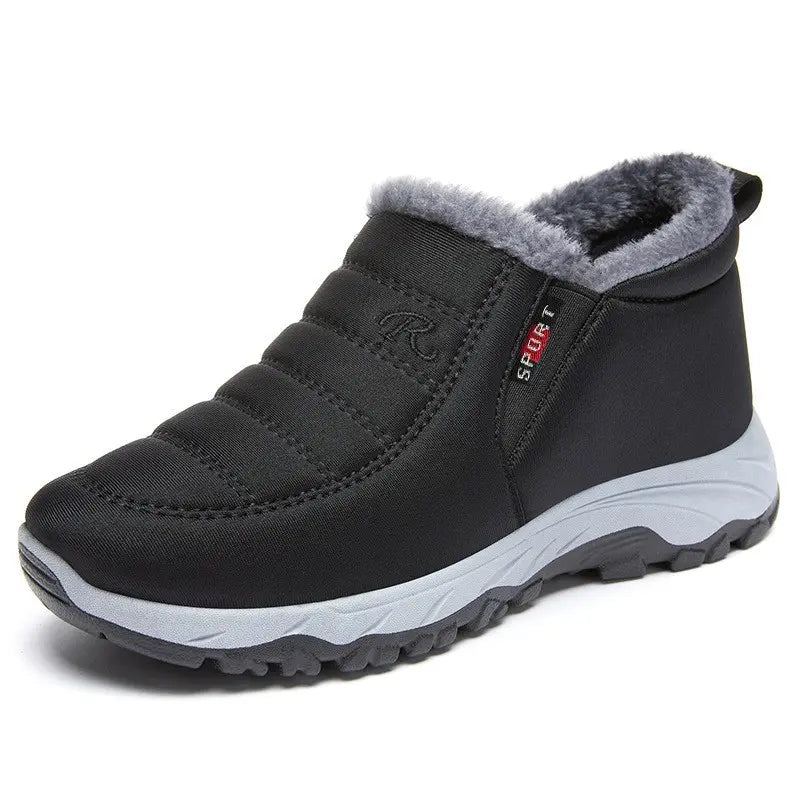Black Zylpha warm winter ankle boots with faux-fur lining, quilted upper, and a durable rubber lug sole. Features easy slip-on design and side SPORT label.