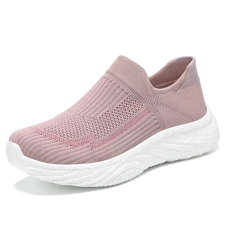 Pink Zylpha casual slip-on sneakers featuring a breathable engineered knit upper and a white sculpted sole, showcased from a three-quarter angle.