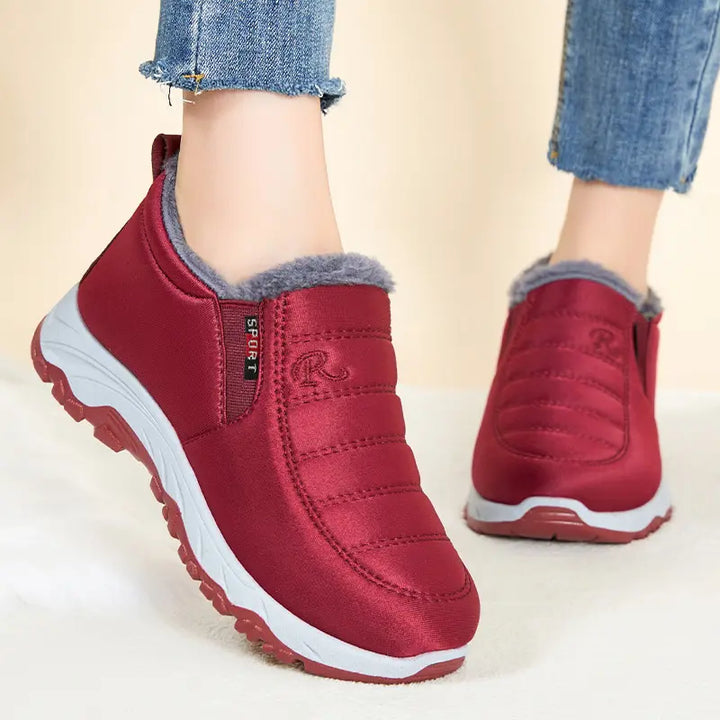 Red Zylpha warm winter boots with plush faux-fur lining, quilted synthetic upper, and durable rubber lug sole, shown from a front angle.