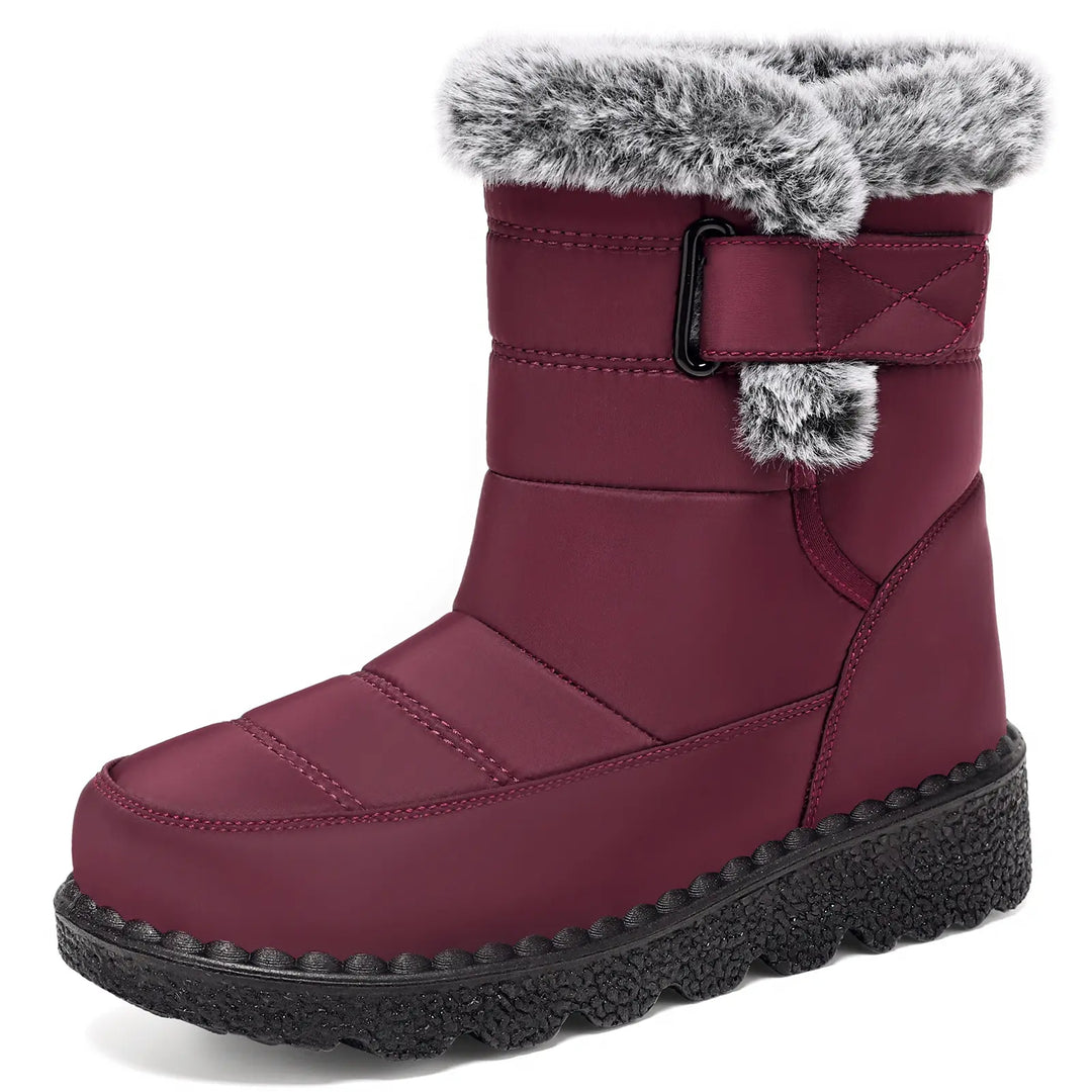 Zylvaia mid-calf winter boots in a deep burgundy quilted water-resistant synthetic material, featuring a plush faux fur collar and a chunky lugged rubber sole, shown from the front.