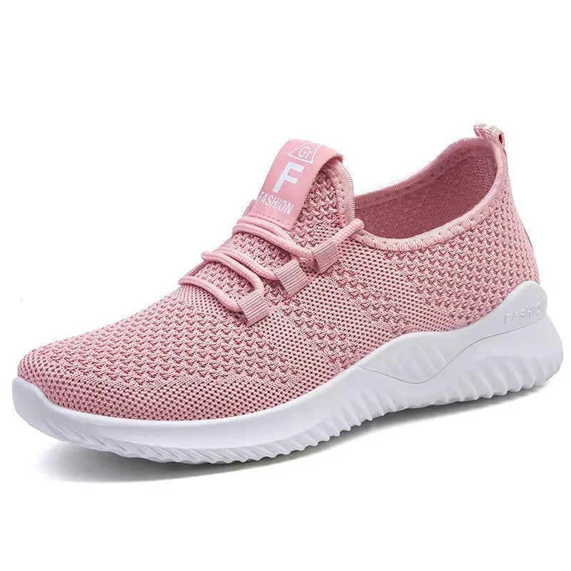 Zyphor Women's Breathable Mesh Sneakers in soft pastel pink, featuring a three-quarter front view, integrated non-functional laces, and a sculpted white sole with embossed 'FASHION' detail.