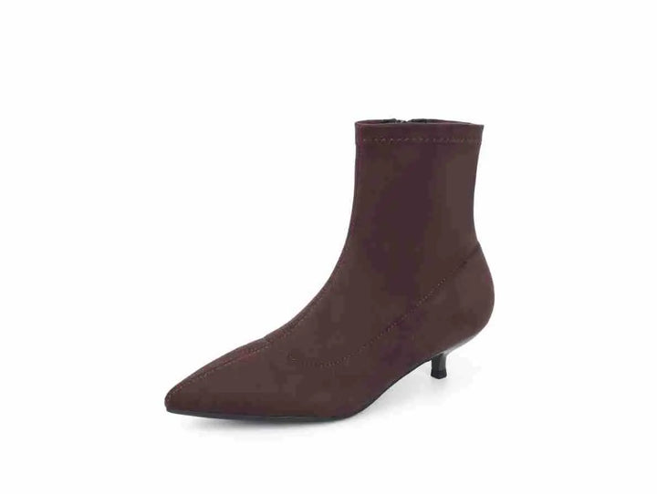 Chic dark brown stiletto ankle boot with a pointed toe and stretch sock-like shaft, shown from a three-quarter front view.