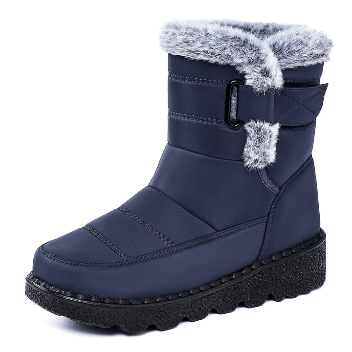 Navy blue mid-calf winter boots with water-resistant quilted upper, plush faux fur lining, side zip, buckle strap, and thick platform wedge sole for warm comfort.