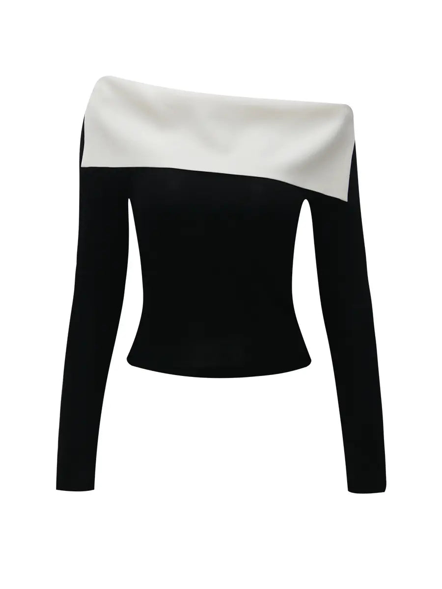 Zythos black long-sleeved knit top with an asymmetrical off-shoulder neckline featuring a bold optic white contrasting panel. Flat lay view showcasing modern chic design.