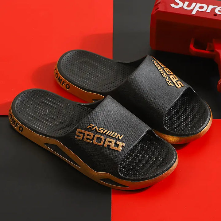 Black Zytri sport slides featuring gold &