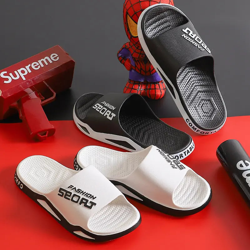 Zytri Comfort Slides in white and black with 'Fashion Sport' branding, arranged with props on a red and black background.