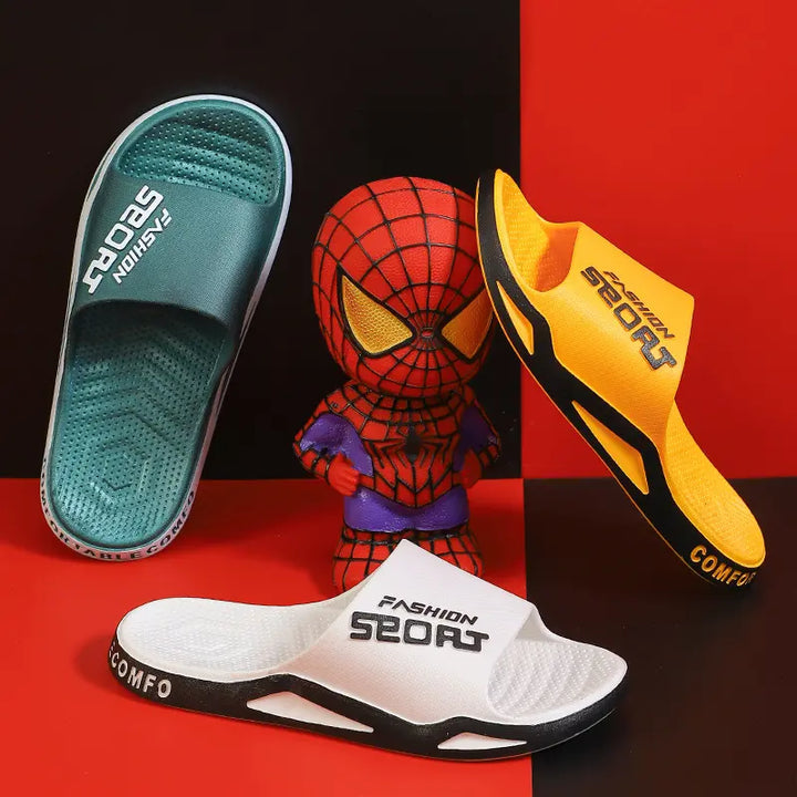 Three Zytri sport slides in green, yellow, and white arranged with a Spider-Man figurine against a checkered red and black background.